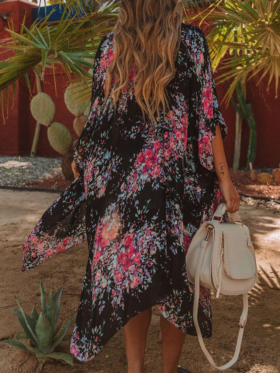 a woman in a black and pink dress carrying a white bag