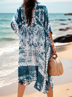 a woman standing on a beach holding a straw bag
