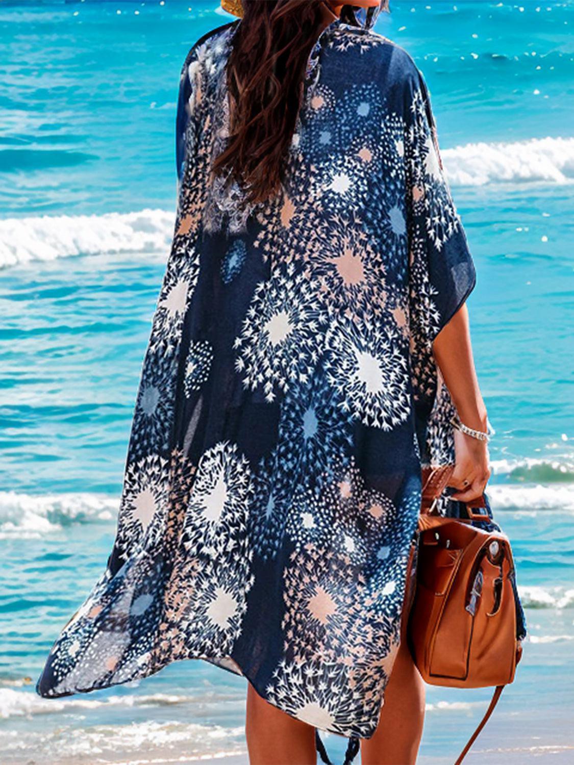 a woman standing on a beach next to the ocean