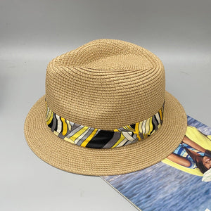 a straw hat sitting on top of a magazine