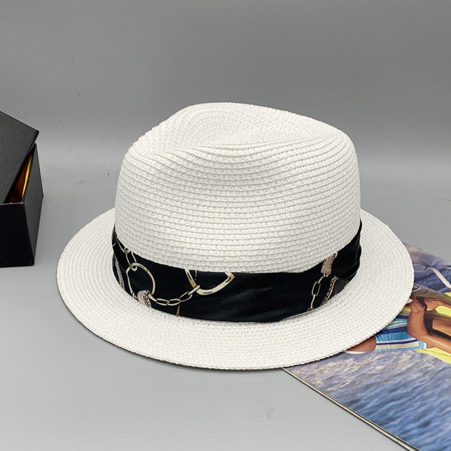 a white hat sitting on top of a table