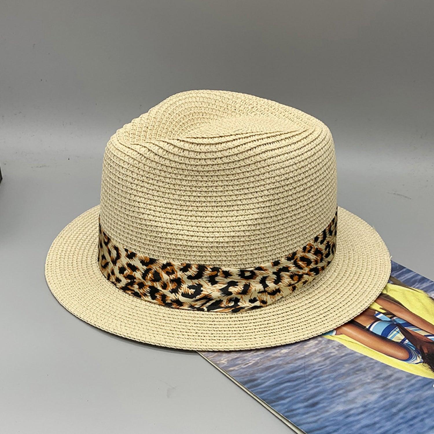 a white hat with a leopard print band