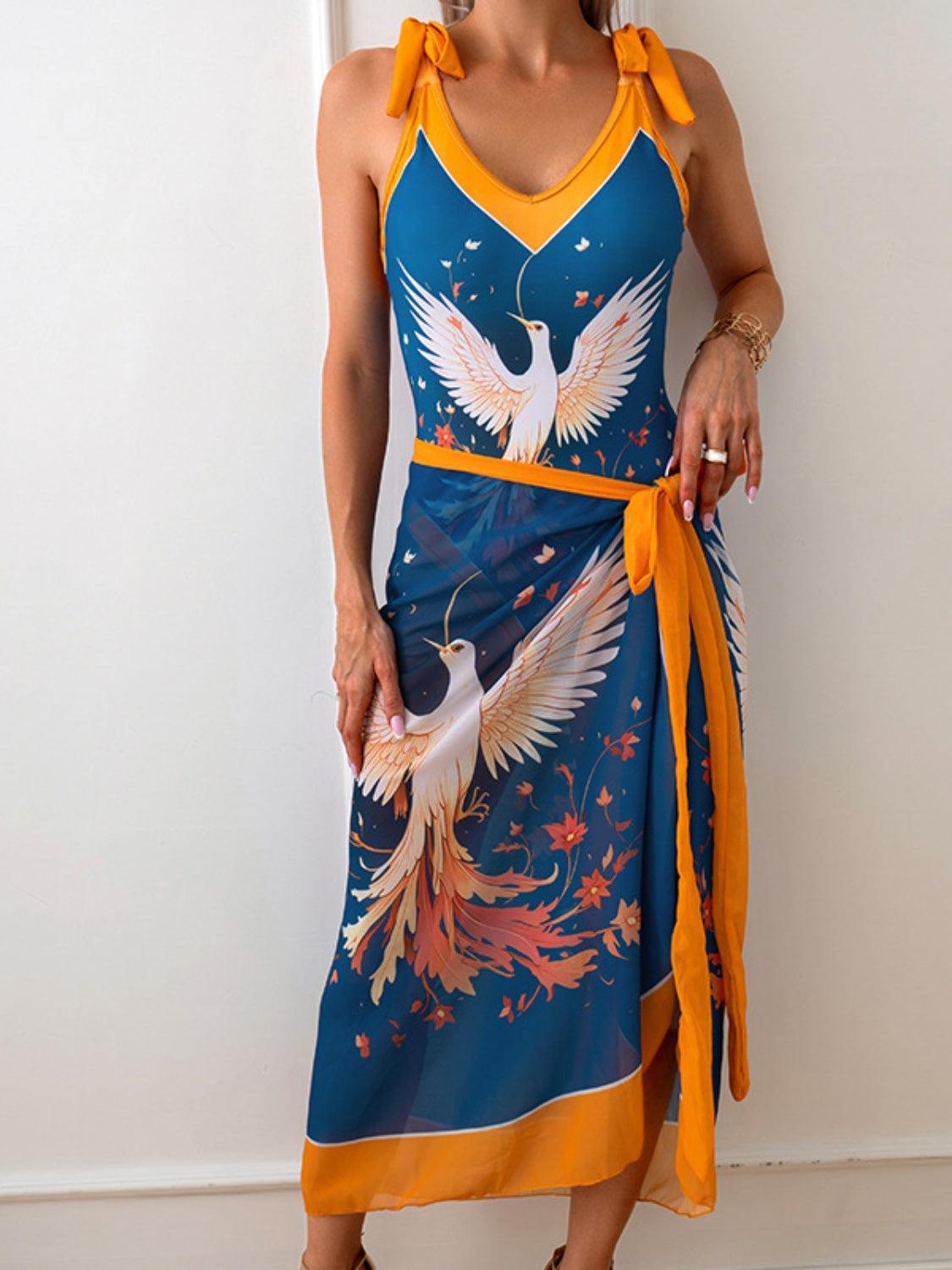 a woman in a blue and yellow dress with a bird on it