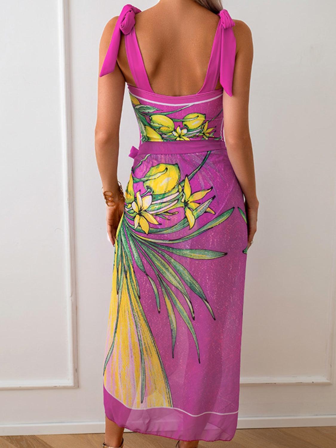 a woman wearing a purple dress with yellow flowers on it