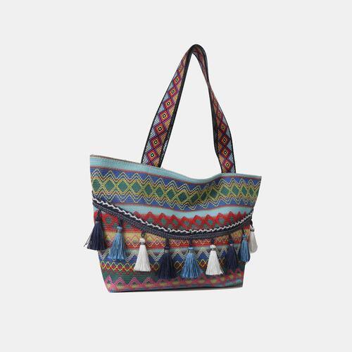 a multicolored bag with tassels and fringes