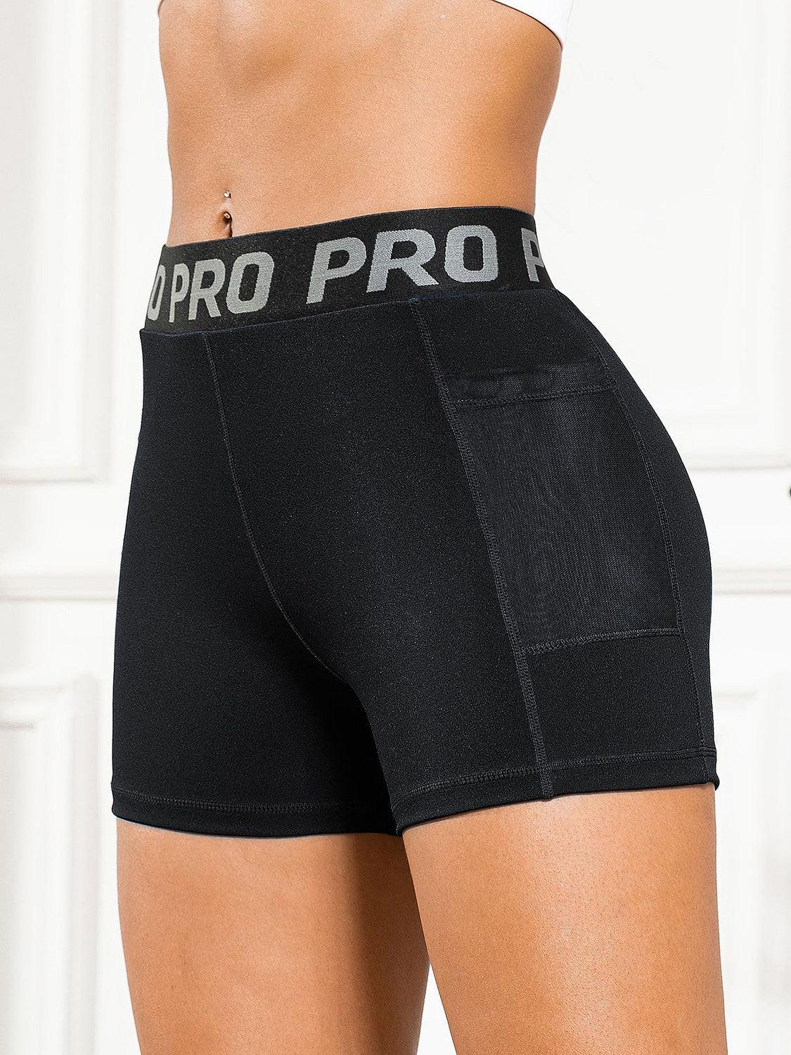 a woman in black shorts with the word pro pro printed on it
