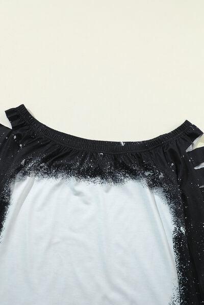 a black and white shirt with black and white paint splattered on it