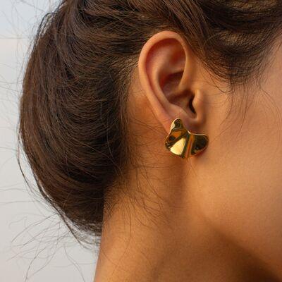 a close up of a person wearing a pair of earrings