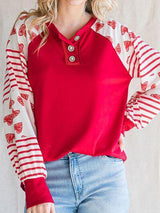 a woman wearing a red and white striped shirt