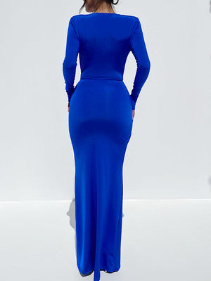 a woman in a blue dress is looking back