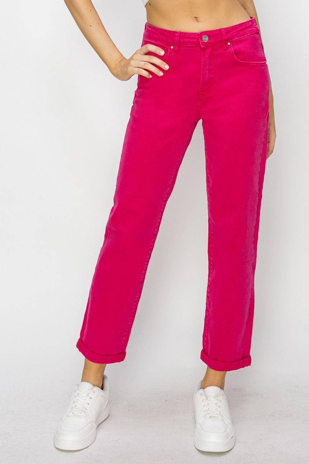 a woman in pink pants posing for a picture