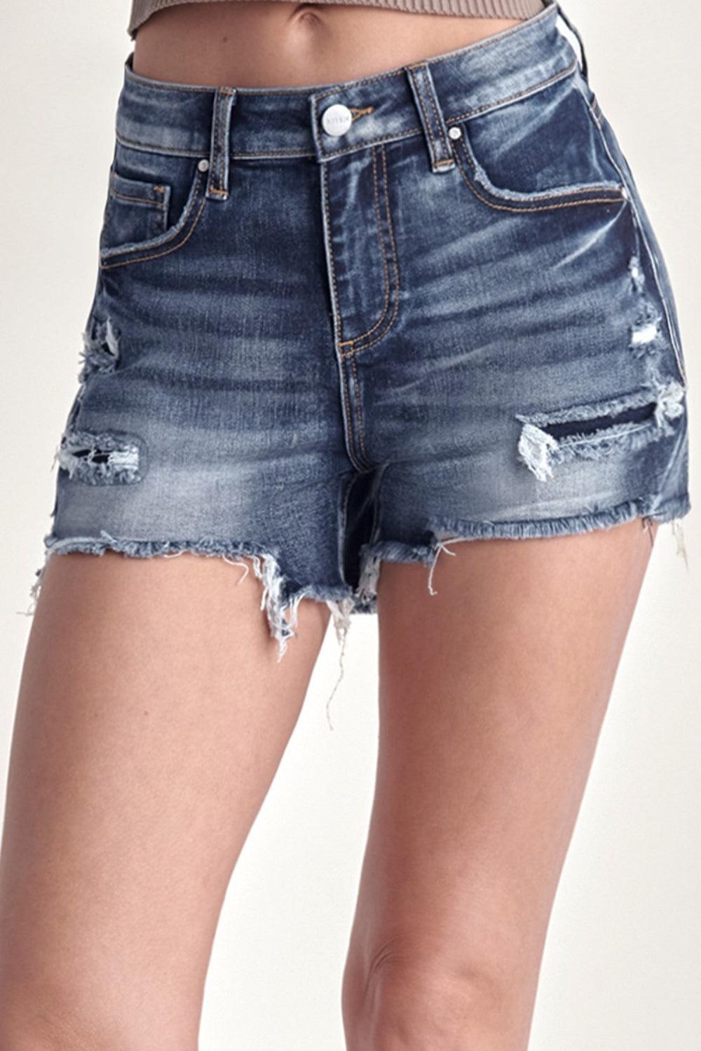 a woman is wearing a pair of shorts