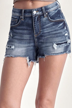 a woman is wearing a pair of shorts