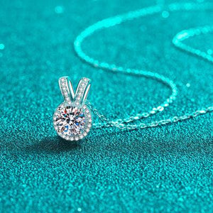 a necklace with a diamond in the shape of a rabbit