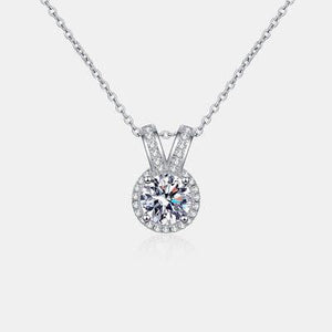a necklace with a round diamond in the center