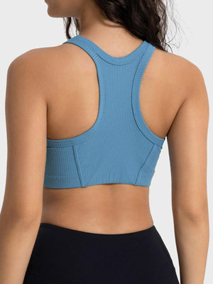 a woman wearing a blue sports bra top