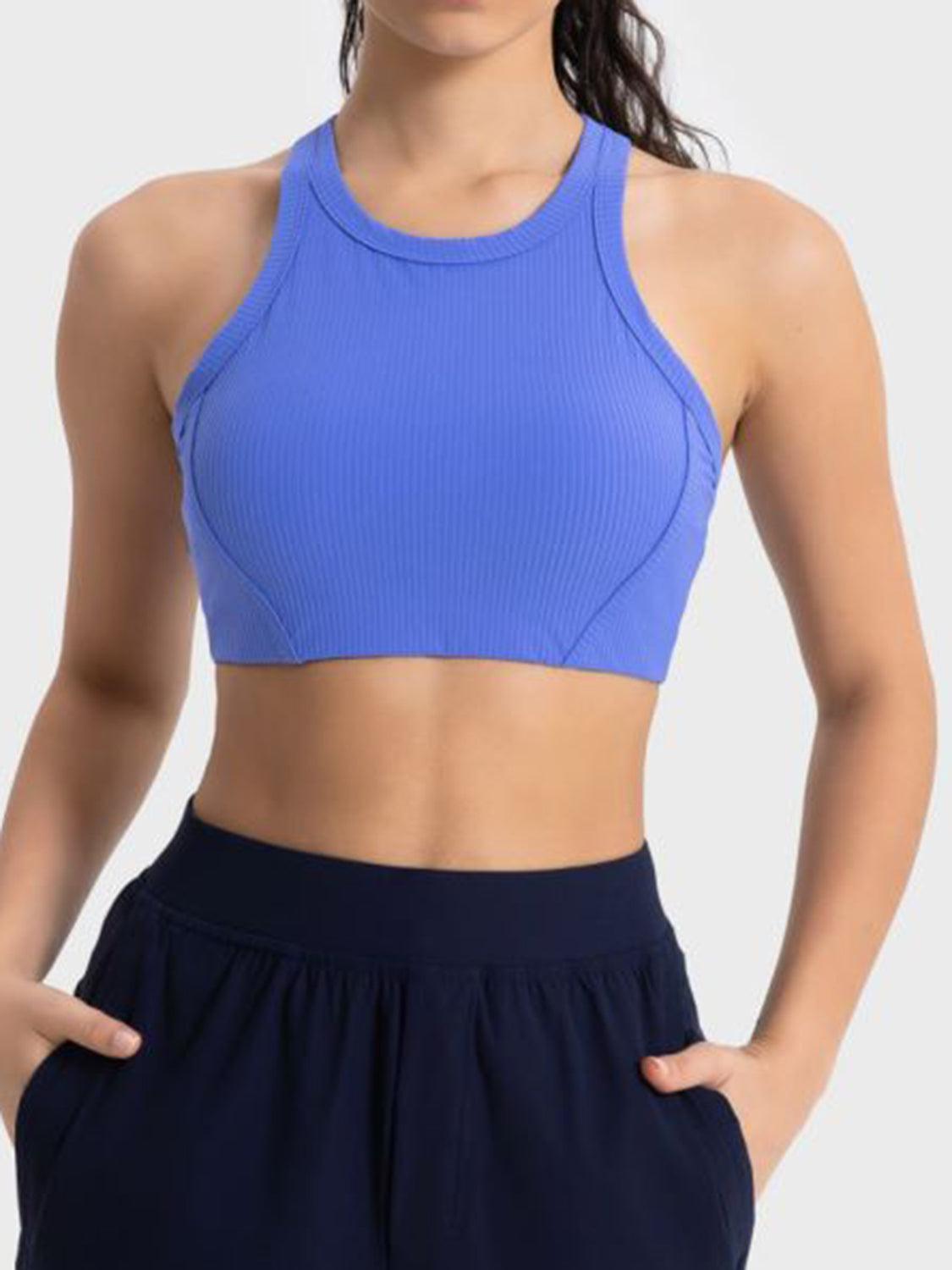 a woman wearing a blue sports bra top