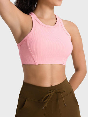 a woman wearing a pink sports bra top