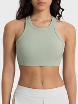 a woman wearing a green sports bra top