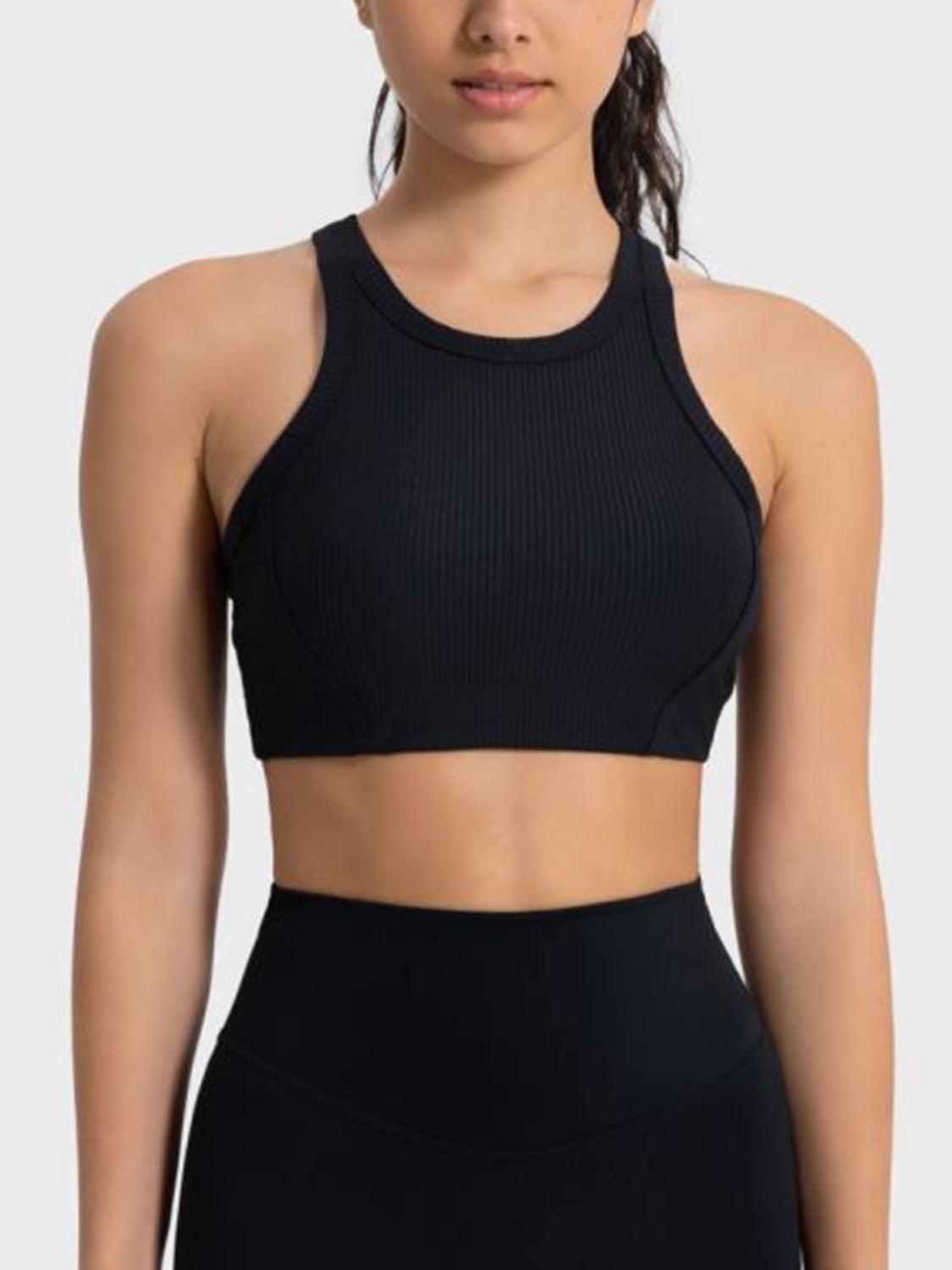 a woman wearing a black sports bra top