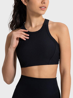 a woman wearing a black sports bra top