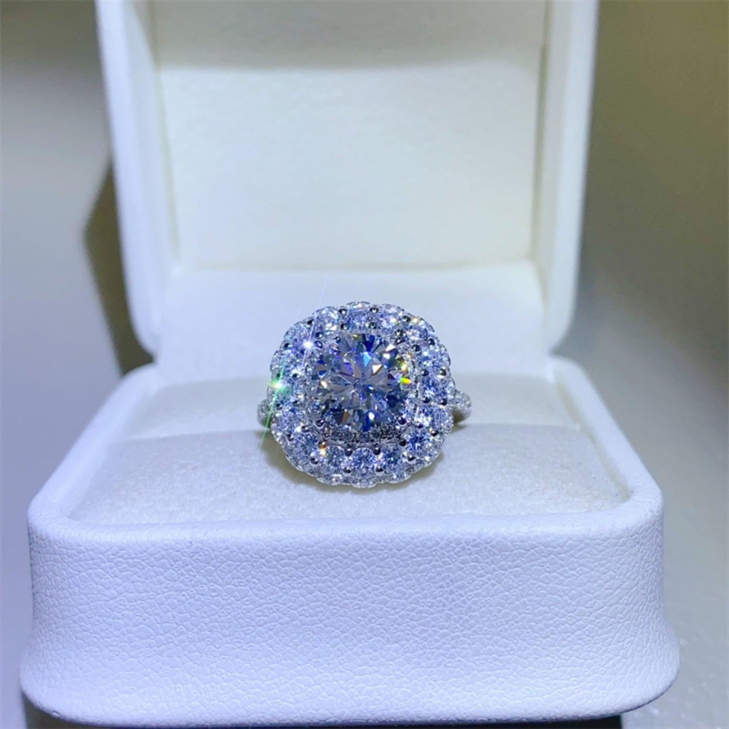 a fancy ring is sitting in a white box