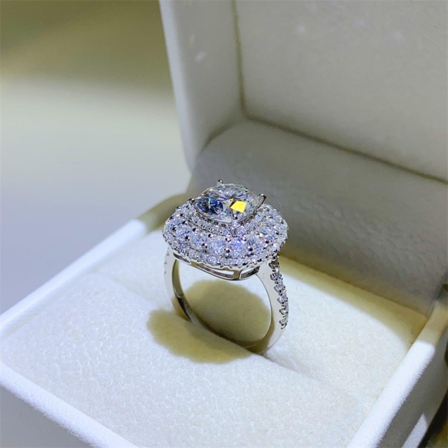 a ring with a blue center surrounded by white diamonds