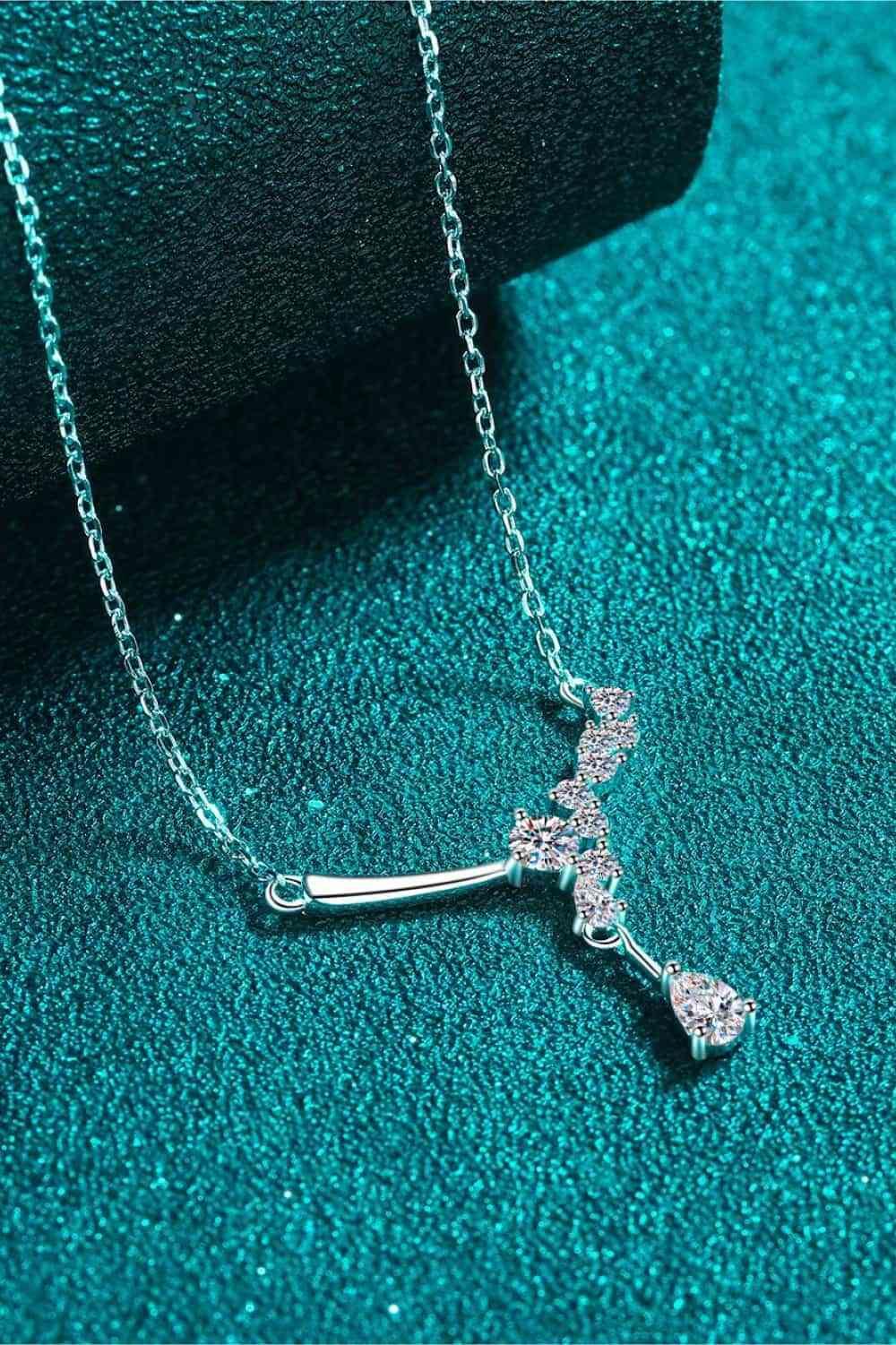 a cross necklace on a blue background