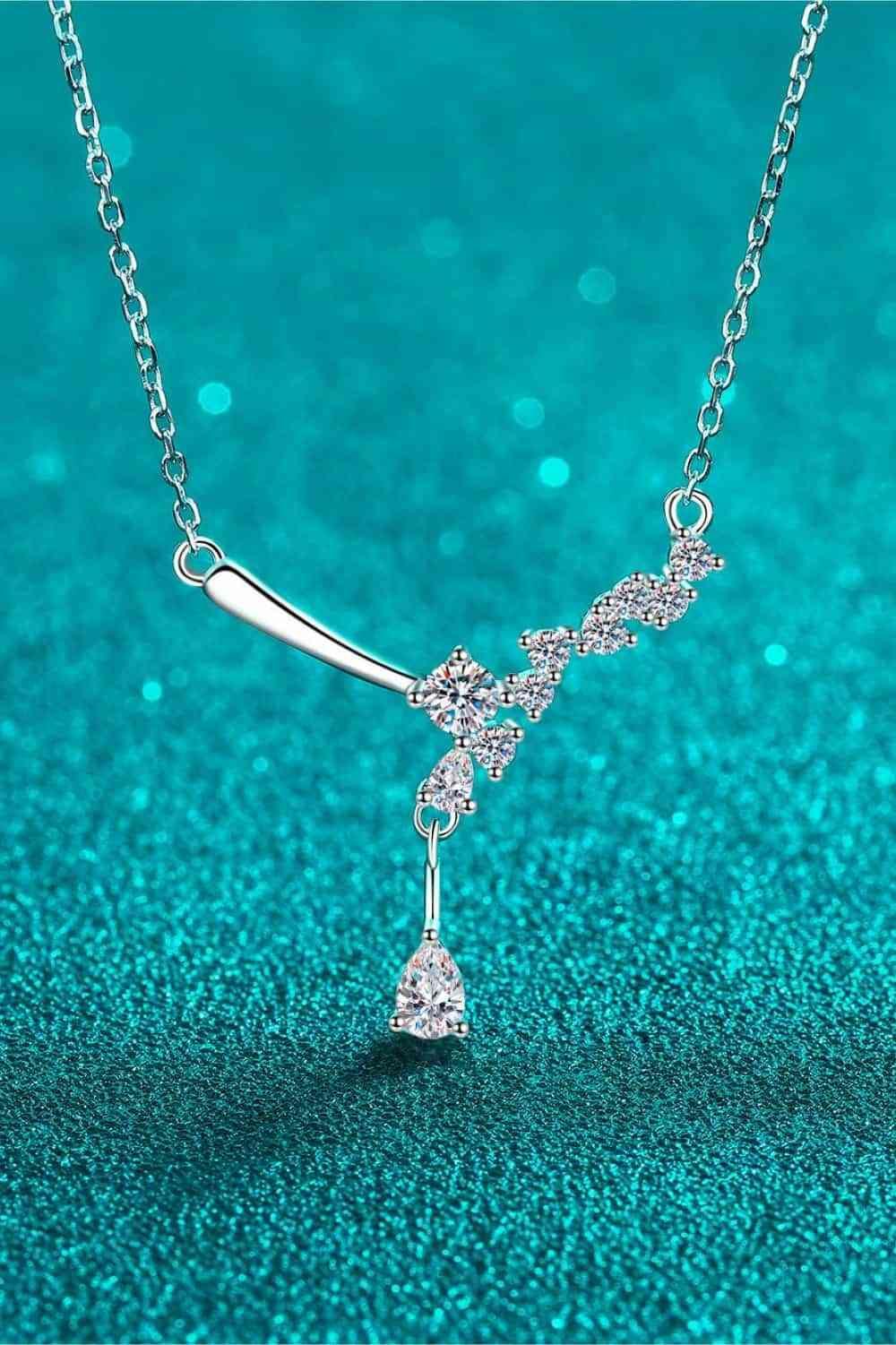 a diamond necklace on a blue background