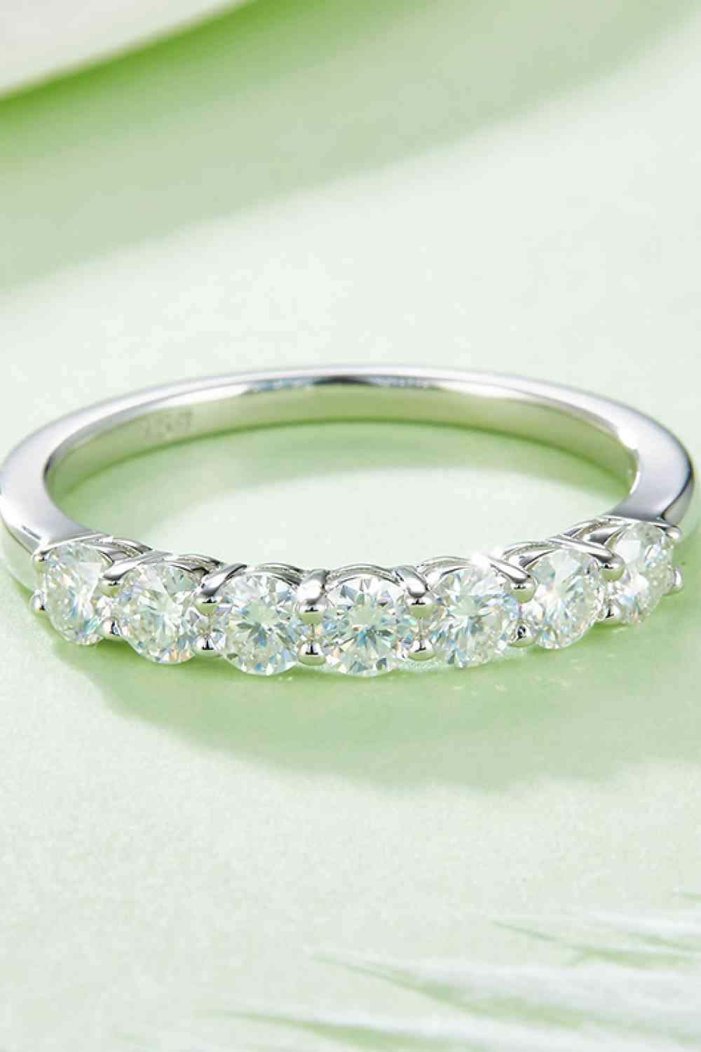 a white gold wedding band with five diamonds