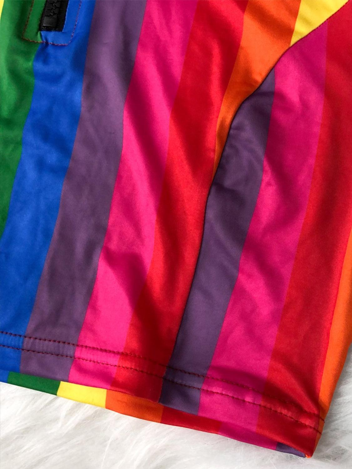 a pair of colorful shorts laying on top of a bed