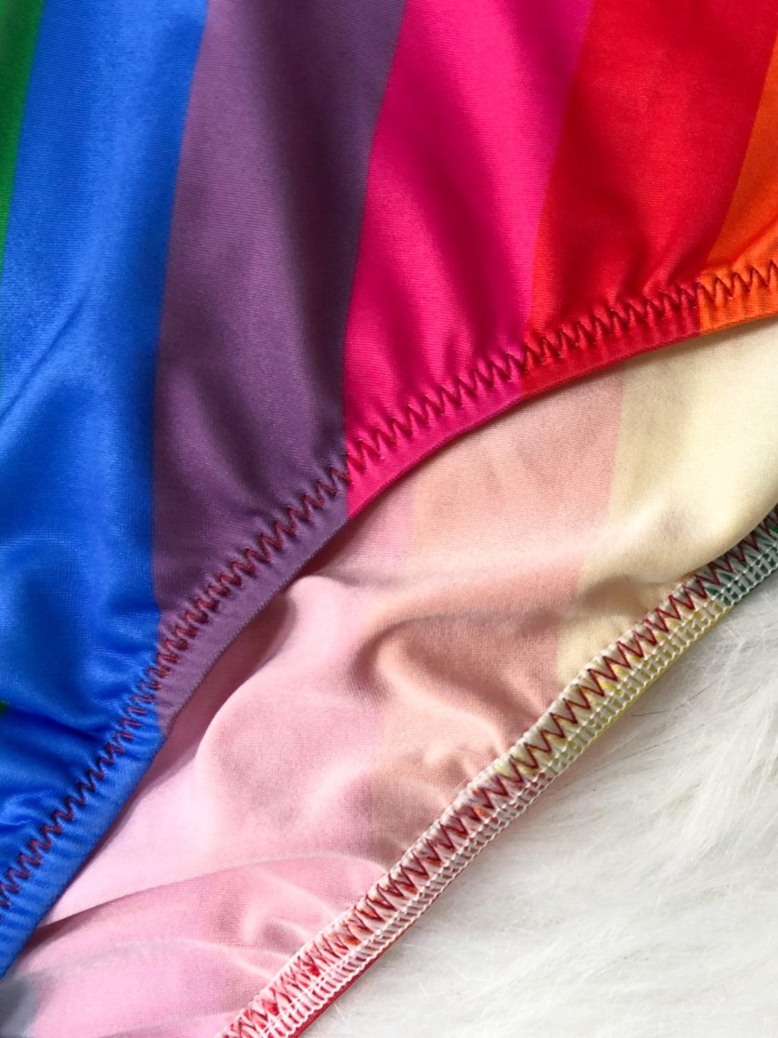 a close up of a rainbow colored swimsuit