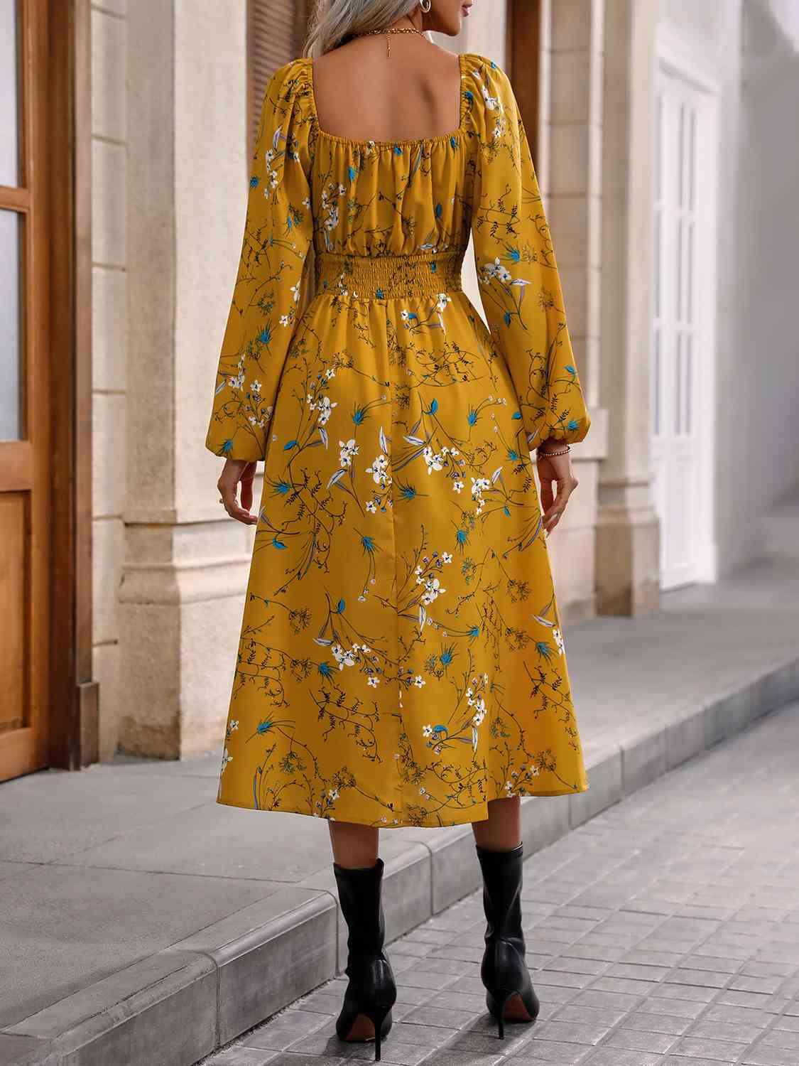 a woman in a yellow dress walking down the street
