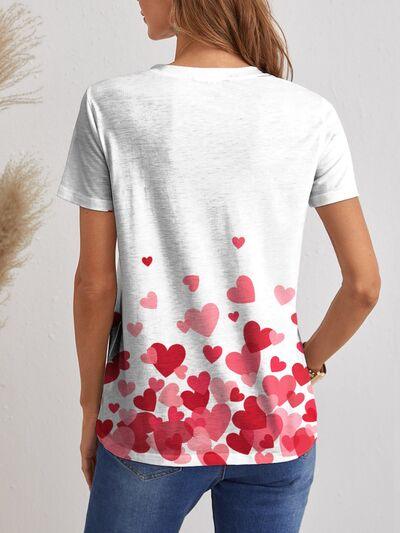 a woman wearing a t - shirt with hearts on it
