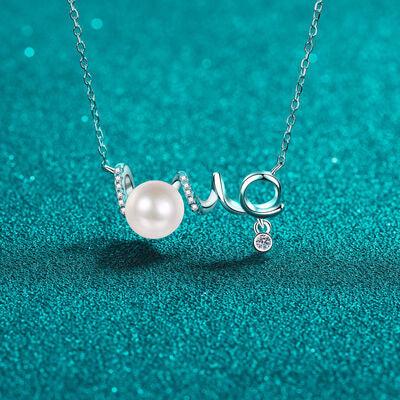 a necklace with a pearl and a diamond on it