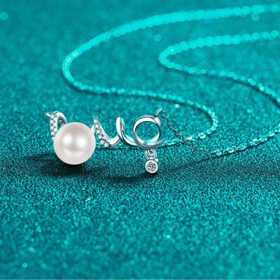 a necklace with a pearl on a chain