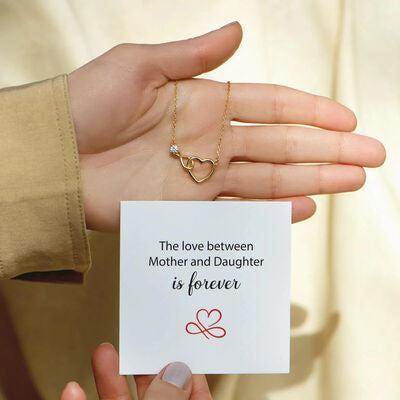 a person holding a card with a heart on it