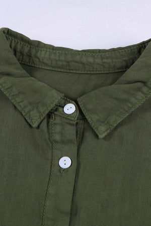 a close up of a green shirt with buttons
