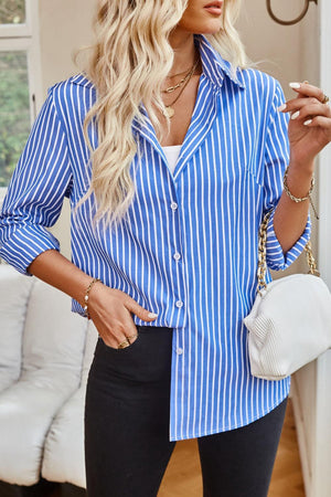 a woman wearing a blue and white striped shirt