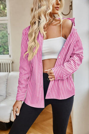 a woman wearing a pink and white striped jacket