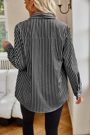 a woman in black and white striped shirt and leggings