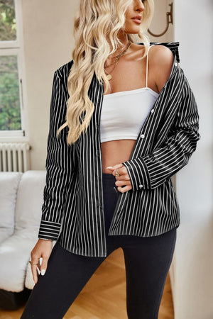 a woman in a black and white striped blazer