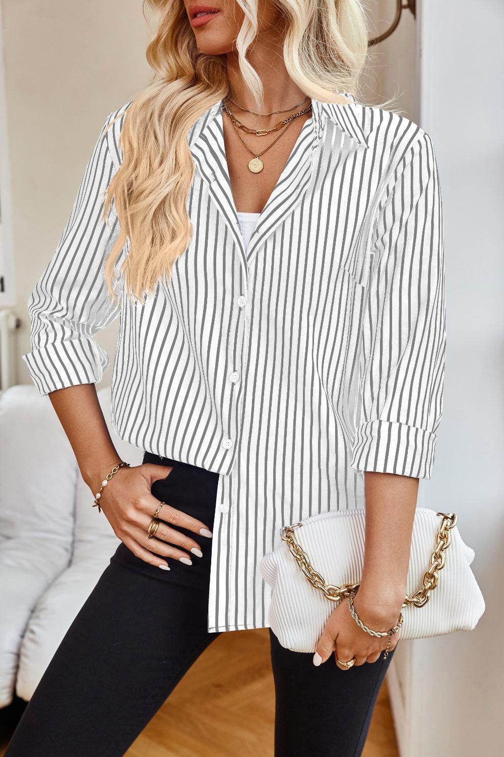 a woman wearing a white and black striped shirt