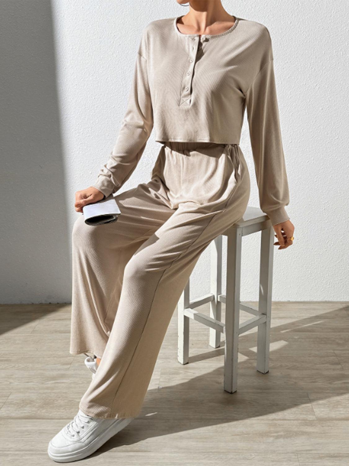 a woman sitting on a stool with a remote control in her hand