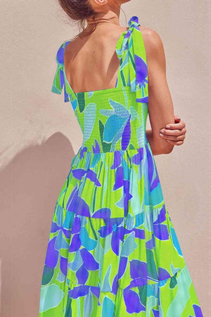 a woman wearing a green and blue dress
