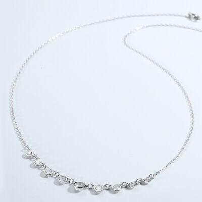 a silver necklace on a white background