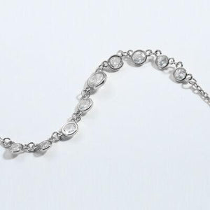 a silver bracelet with a circle design on it