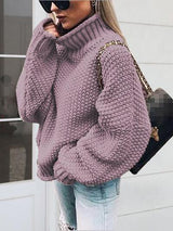 a woman in a purple sweater smoking a cigarette