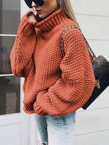 a woman in an orange sweater smoking a cigarette