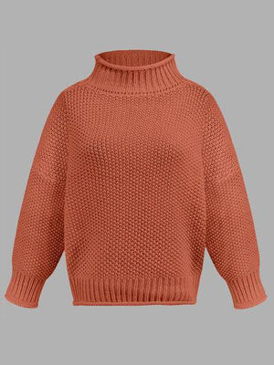 a woman wearing an orange sweater with a turtle neck